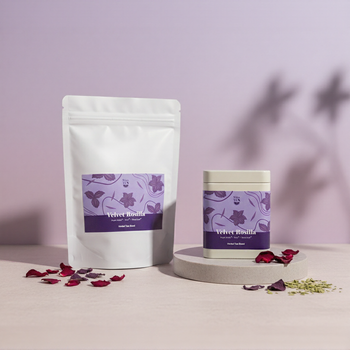 Velvet Rosilla herbal tea blend by Sian Te, shown in both tin and pouch packaging in a product display