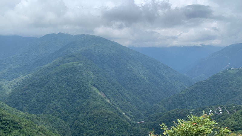 A stunning view of the majestic mountains in Taiwan, showcasing the beauty of the island